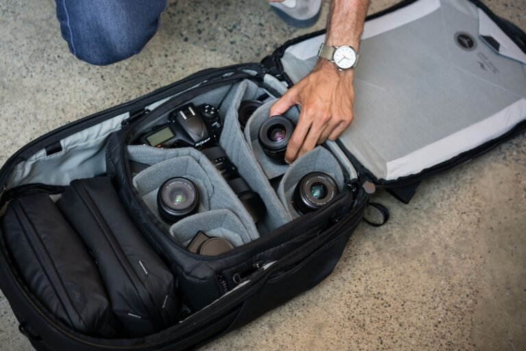 Traveller wearing the Peak Design Travel Backpack 45L with the harness on the shoulders