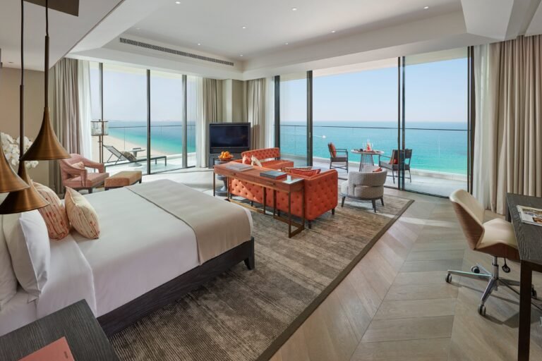 Mandarin Sea Front Suite bedroom opening onto a wraparound sea-view terrace at Mandarin Oriental Jumeira, Dubai