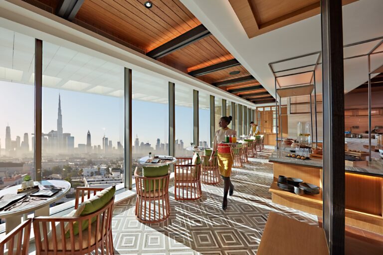 The Club Lounge at Mandarin Oriental Jumeira, Dubai with floor-to-ceiling windows over the Downtown Dubai skyline and Burj Khalifa