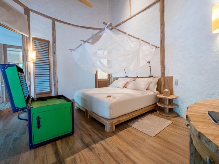 Open-plan living room at Villa 37 five-bedroom villa, Soneva Fushi