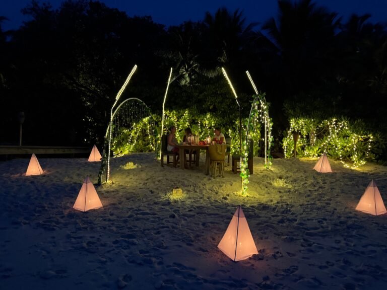 Private beach with sun loungers and white sand at Soneva Fushi Maldives
