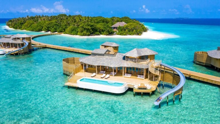 Soneva Fushi resort exterior showing beachfront villas amid tropical jungle, Maldives