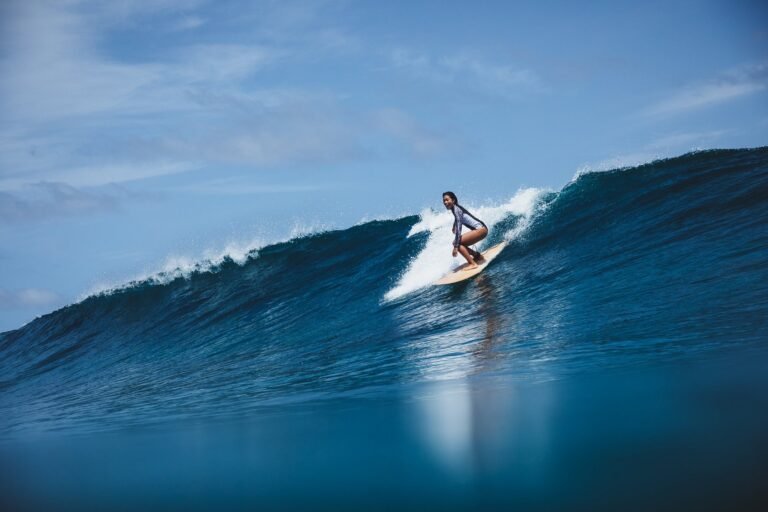 Surfing activity in crystal-clear Maldivian waters near Soneva Fushi resort