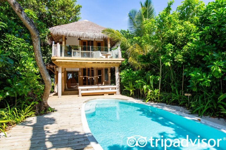 Two-bedroom villa interior with open-air living space and jungle views at Soneva Fushi