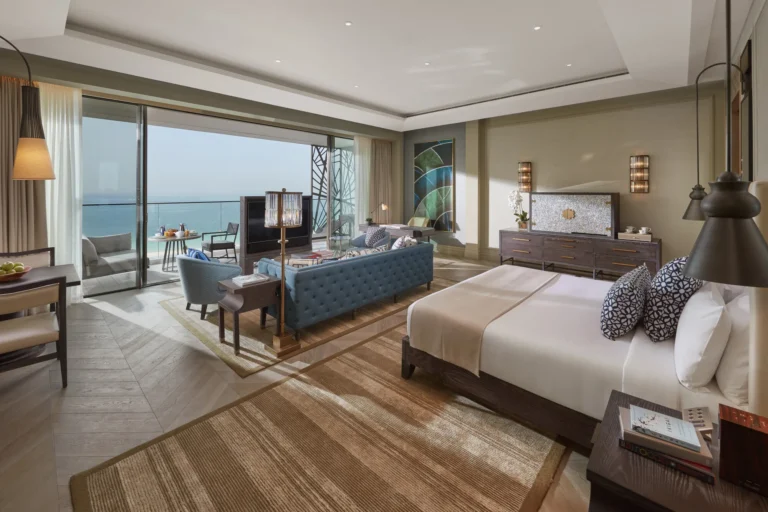Guest room bedroom with king bed and warm wood tones at Mandarin Oriental Jumeira, Dubai