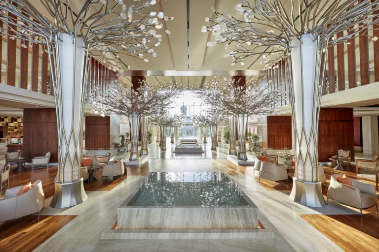 Lobby interior with sculptural branch installations and reception area at Mandarin Oriental Jumeira, Dubai