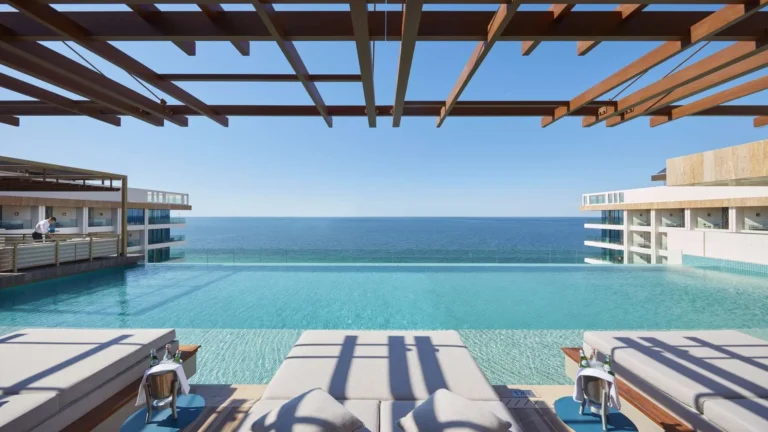 Outdoor terrace at Tasca by Jose Avillez, Mandarin Oriental Jumeira, Dubai, overlooking the sea at dusk