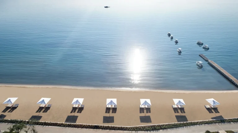 Aerial view over Ikos Dassia beach and sunbeds