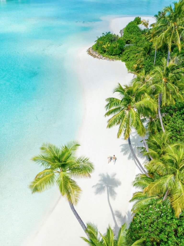 White-sand beach meeting the turquoise lagoon at Cheval Blanc Randheli