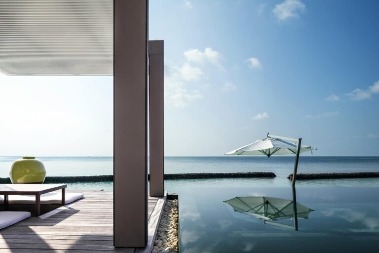 Sunrise over a one-bedroom Water Villa and its pool at Cheval Blanc Randheli