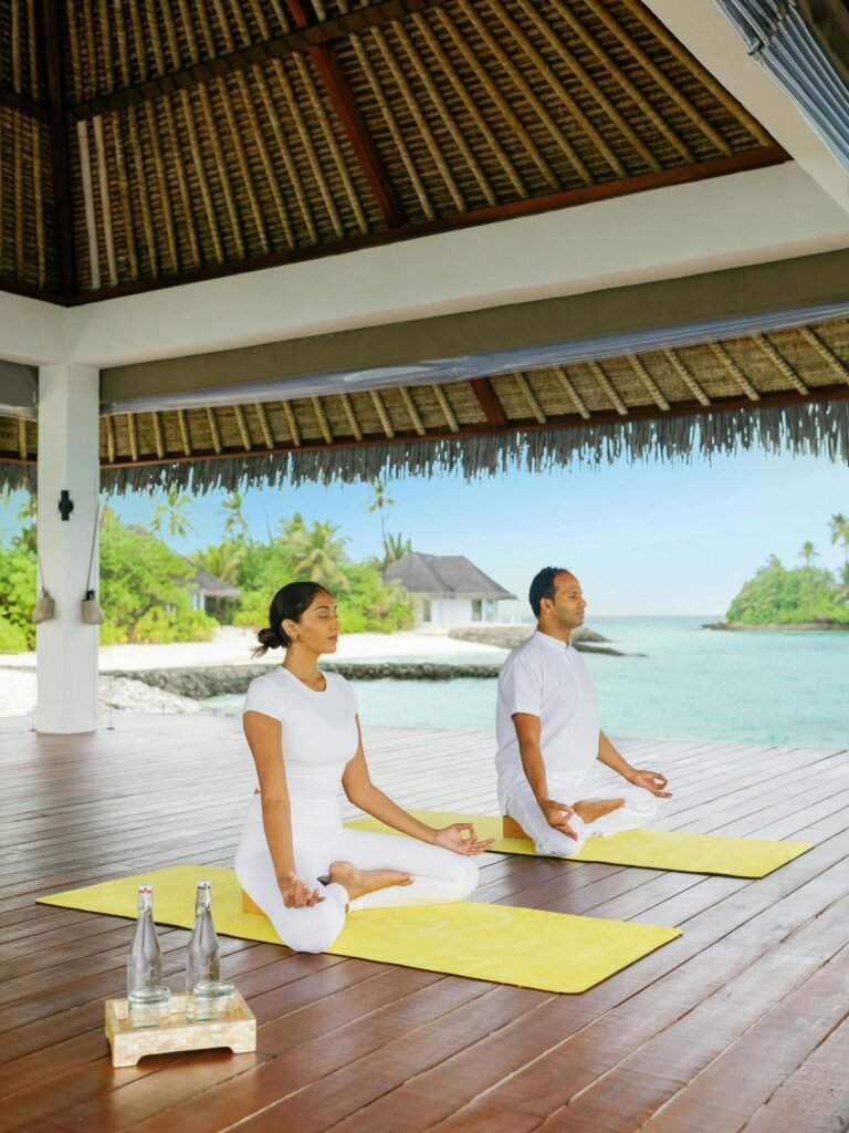 Yoga session on an overwater platform at Cheval Blanc Randheli