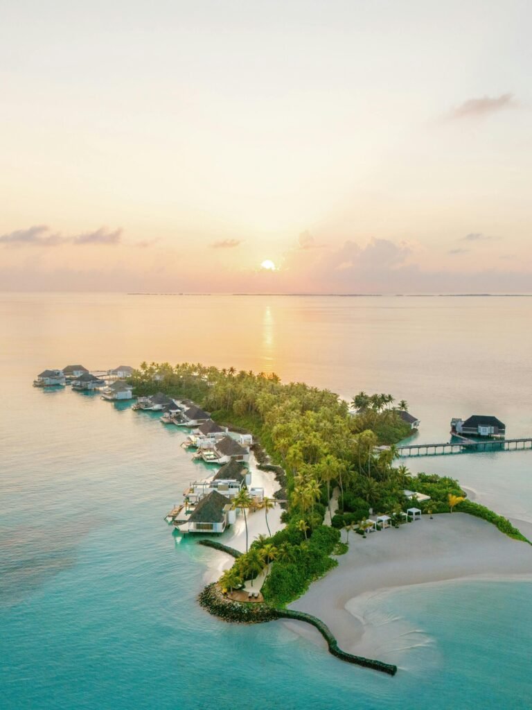 Overwater Lagoon Villas on stilts above the turquoise water at Cheval Blanc Randheli