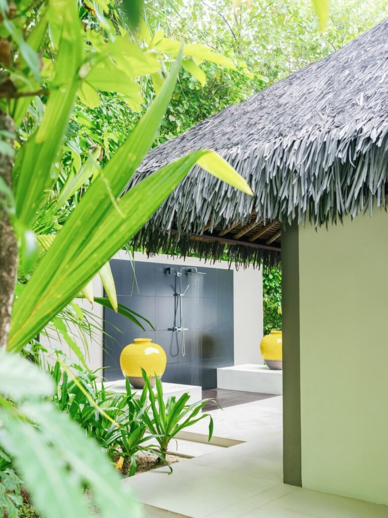 Bathroom with outdoor shower in an Island Villa at Cheval Blanc Randheli