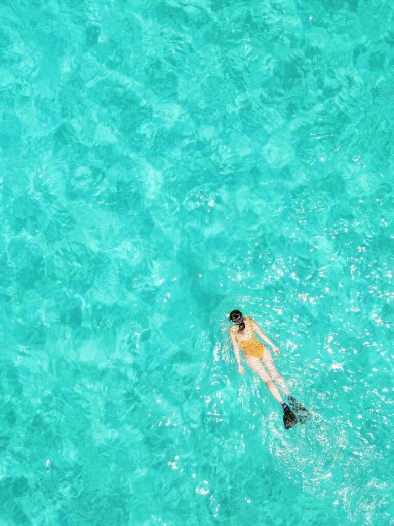 Family snorkelling in the lagoon at Cheval Blanc Randheli