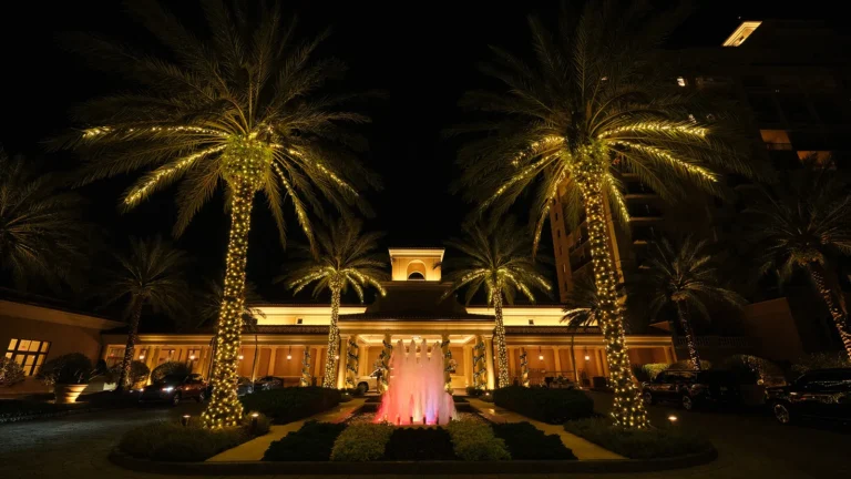 Four Seasons Resort Orlando illuminated at twilight, viewed across the grounds