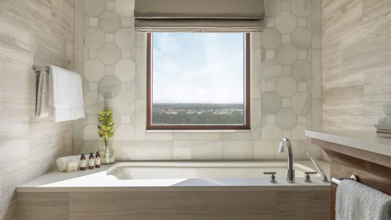 Guest bathroom at Four Seasons Resort Orlando with a soaking tub positioned beneath a window
