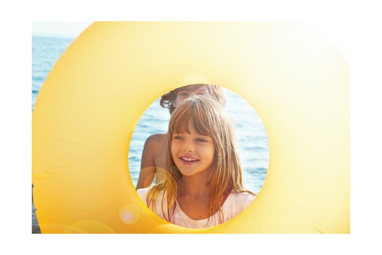 Children laughing and playing together outdoors at an Ikos resort