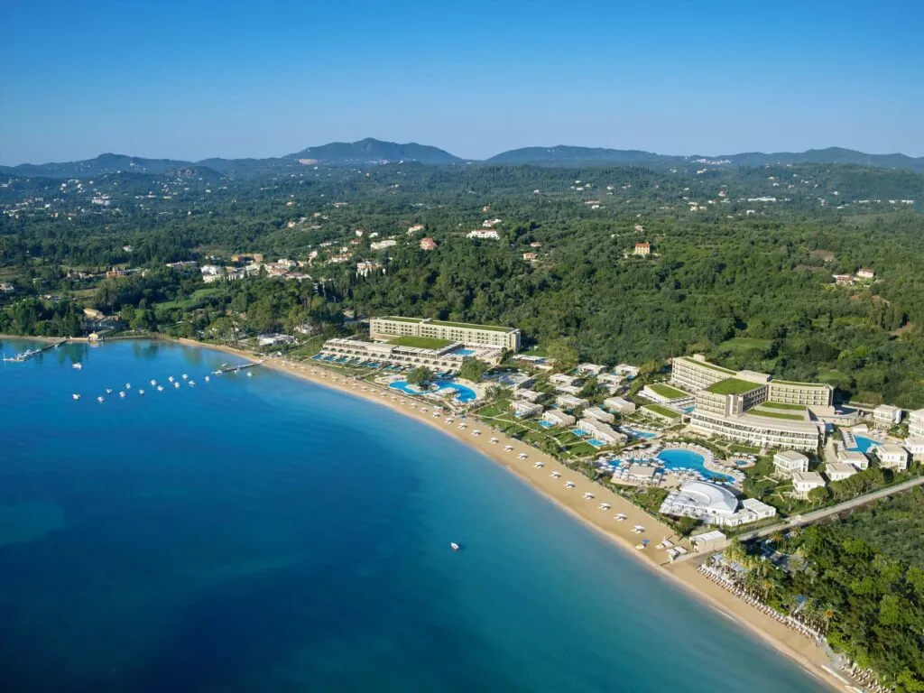 Overhead aerial of Ikos Dassia gardens, pools and beachfront
