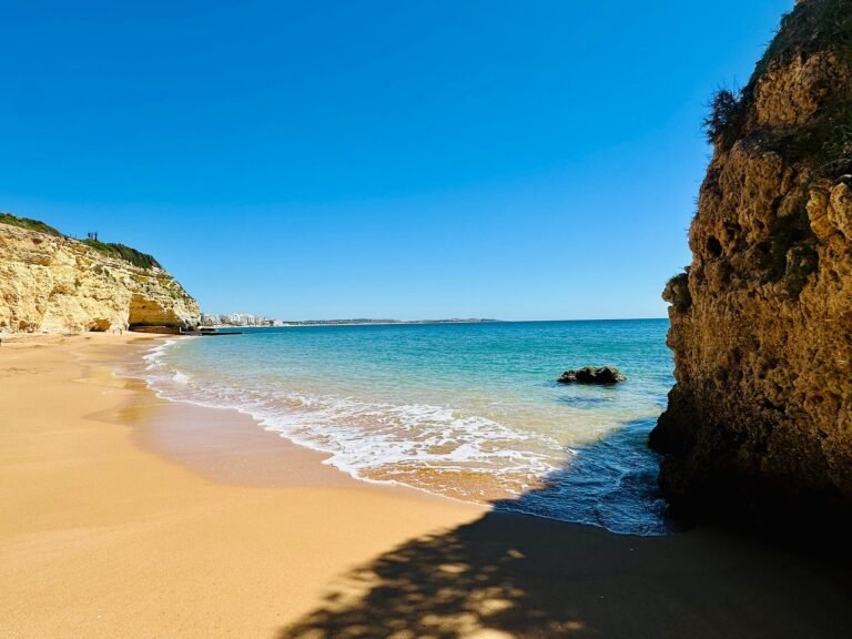Beach cove with golden sand and turquoise sea near Vila Vita Parc