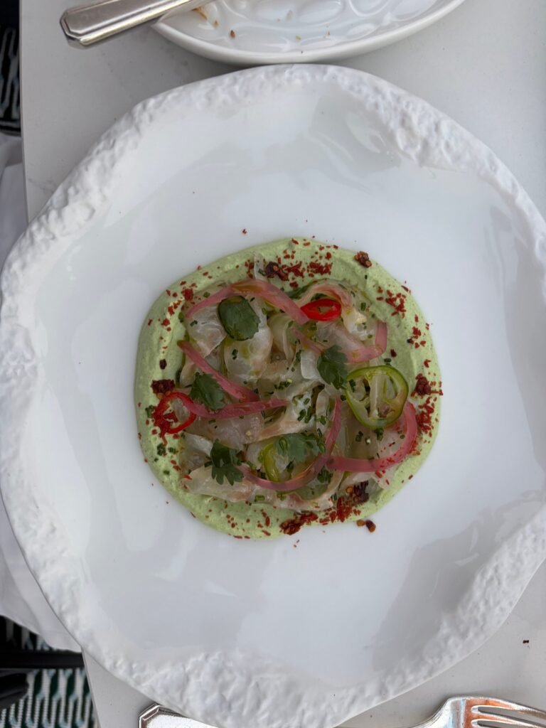 Sea bass ceviche on green sauce plated at Vila Vita Parc