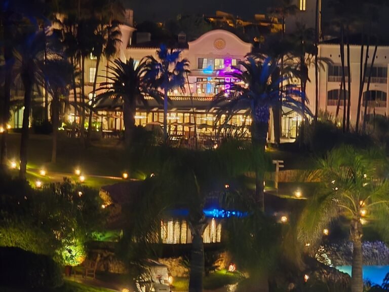 Vila Vita Parc resort illuminated at night among floodlit palms