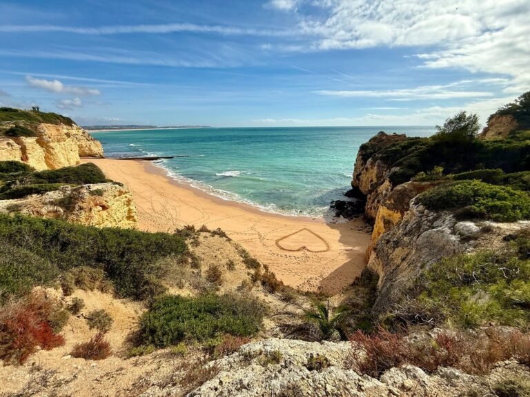 Heart drawn in the sand of a cove beach near Vila Vita Parc
