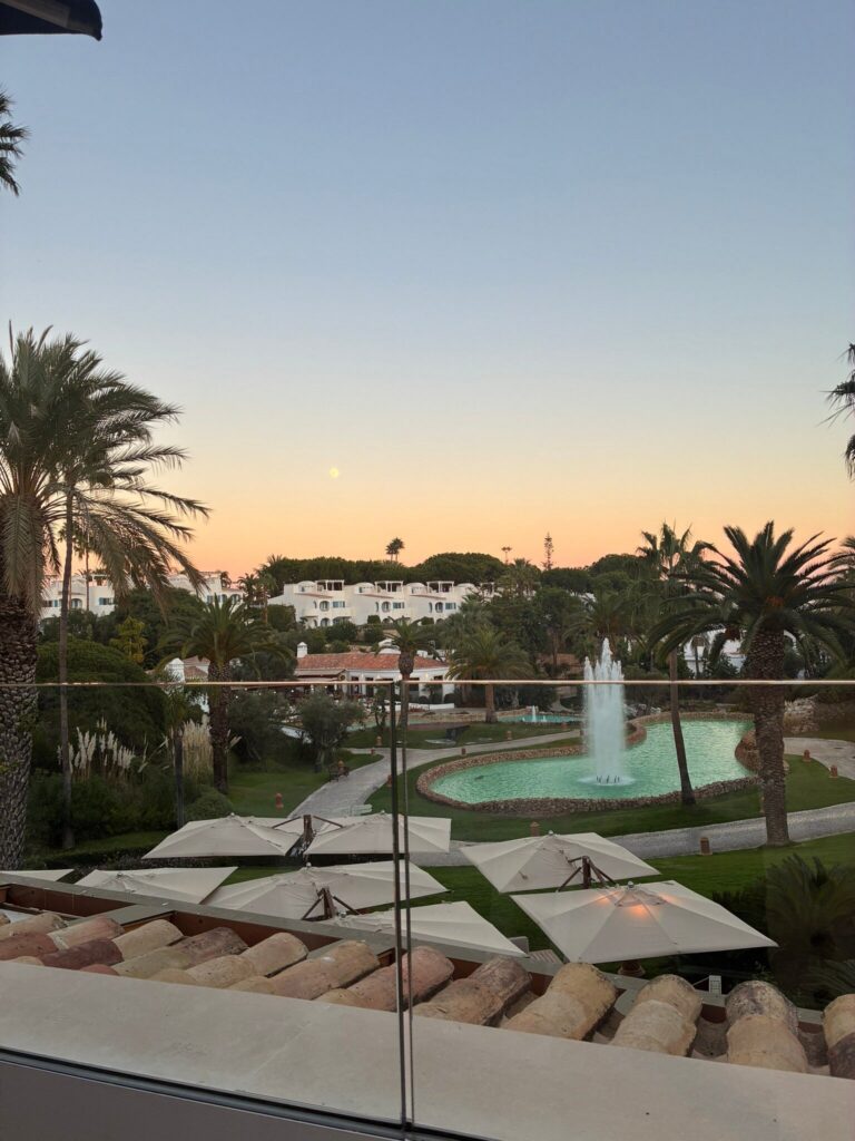 Gardens and fountain lake at sunset seen from a Vila Vita Parc terrace