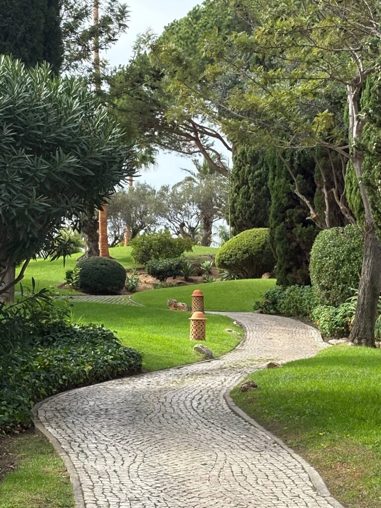 Estate buildings and gardens on the clifftop above the sea at Vila Vita Parc