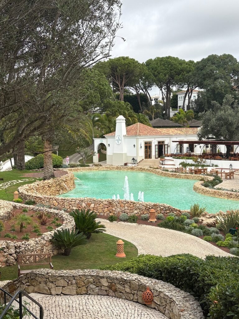Palm-lined gardens with a glimpse of the sea at Vila Vita Parc