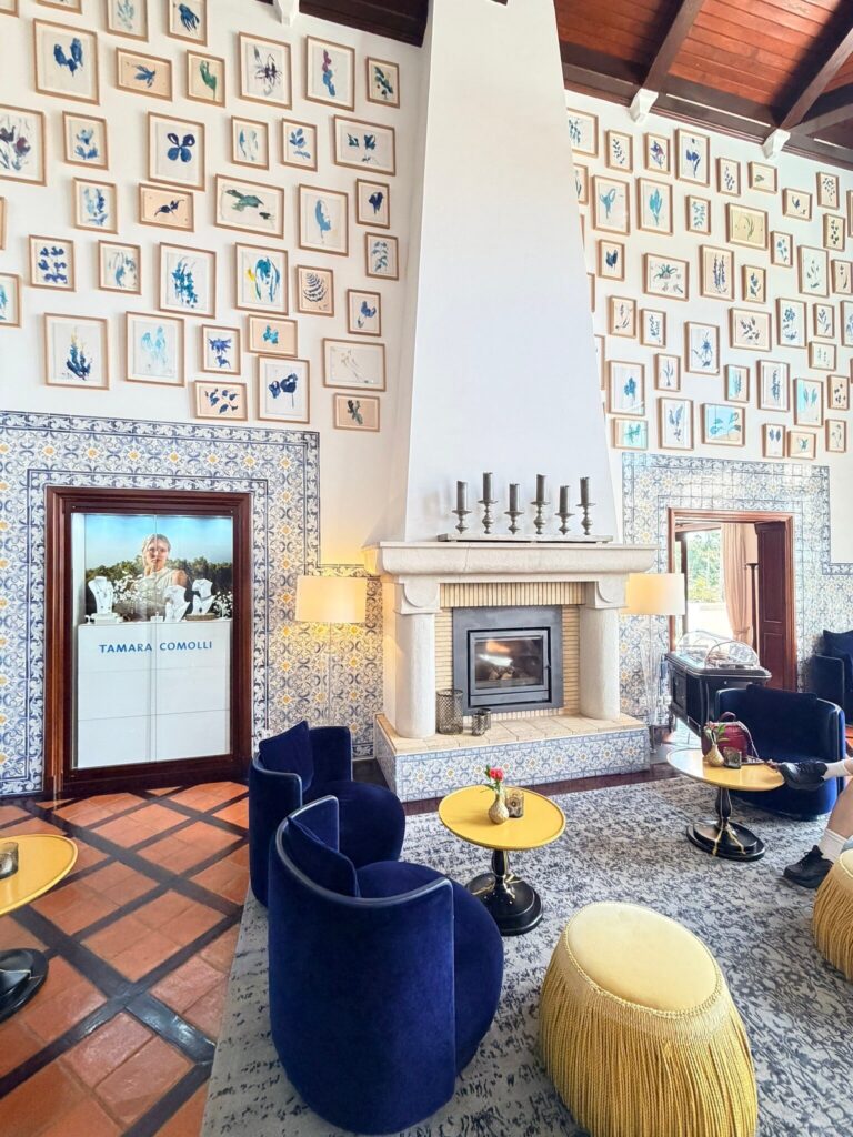 Library lounge at Vila Vita Parc with leather sofas and book-lined walls