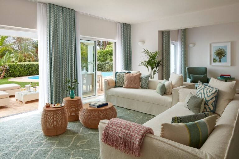 Suite living room at Vila Vita Parc opening onto a private garden and pool