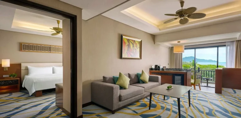 Garden Wing Executive Suite living area at Shangri-La Rasa Ria with sea view and balcony