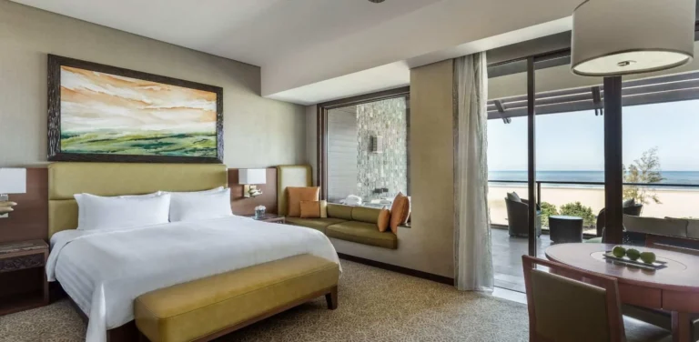 Ocean Wing Junior Suite sea view room at Shangri-La Rasa Ria with large windows and South China Sea panorama
