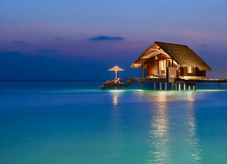Overwater villa exterior at One&Only Reethi Rah seen from the lagoon, Maldives