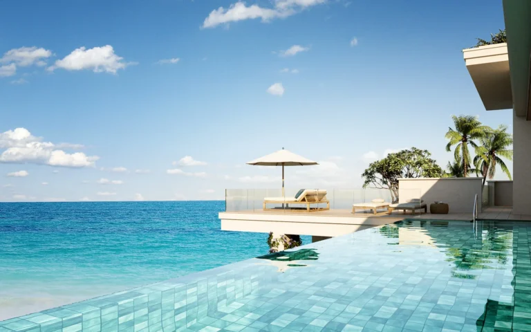 Full-width pool and beach view at Six Senses La Sagesse resort