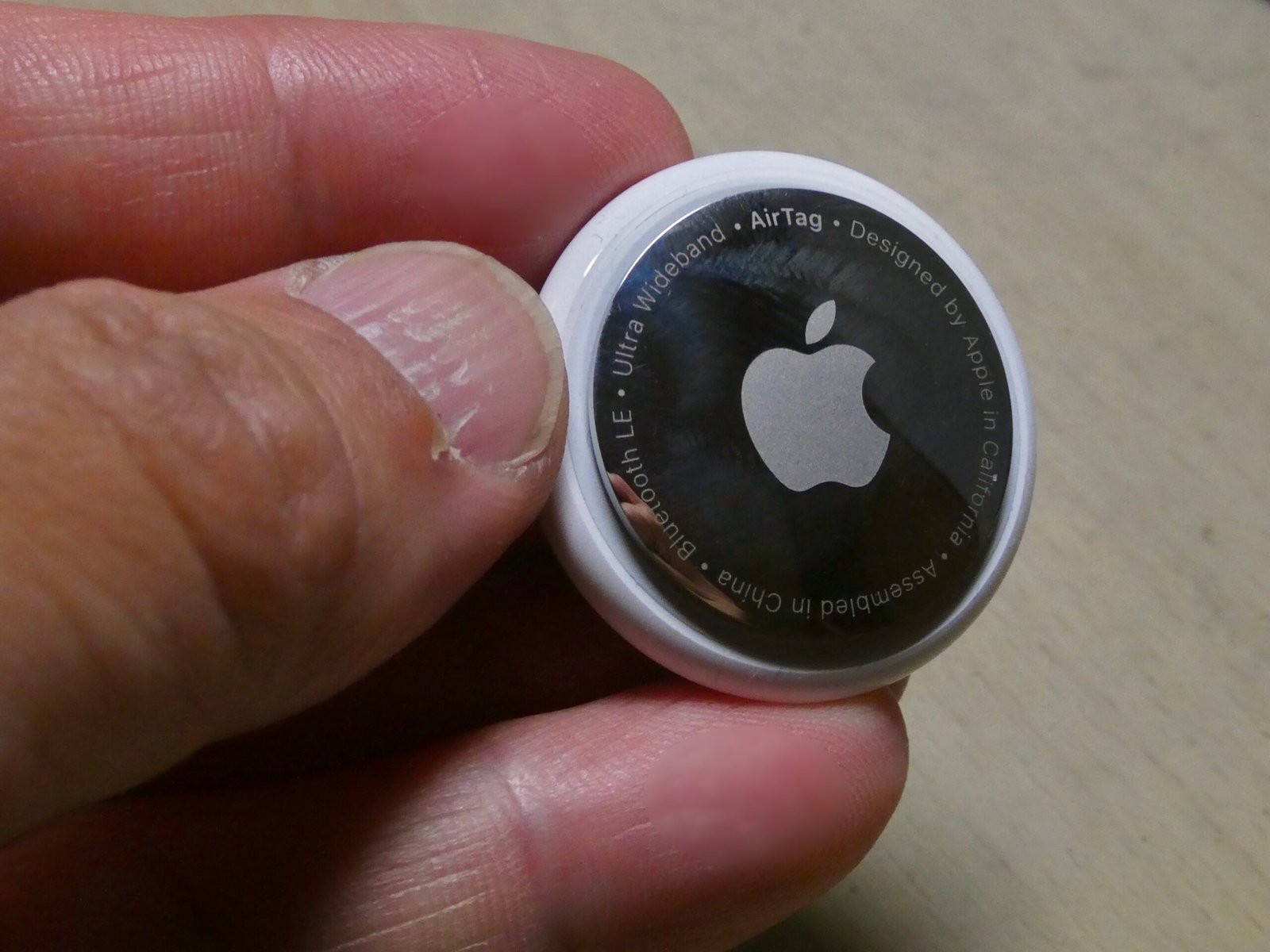 Apple AirTag 2nd Generation — clean studio shot showing the front face