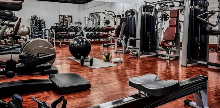 Fitness centre at One&Only Reethi Rah with gym equipment and tropical garden views