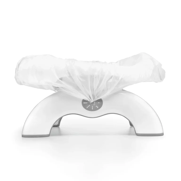 OXO Tot 2-in-1 Go Travel Potty unfolded in freestanding mode with its drawstring travel bag beside it