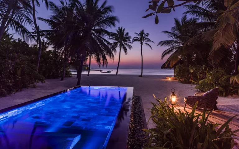 Private plunge pool of a beach villa at One&Only Reethi Rah surrounded by tropical garden