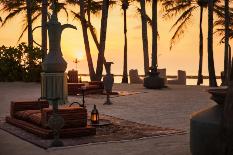 Fanditha dining terrace at One&Only Reethi Rah overlooking the Indian Ocean at dusk