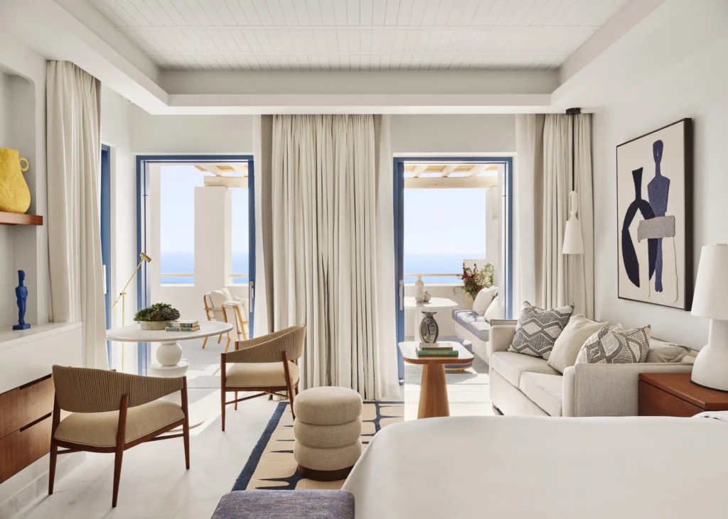 Cliffside pool deck at Four Seasons Hotel Mykonos overlooking the private beach at Kalo Livadi Bay
