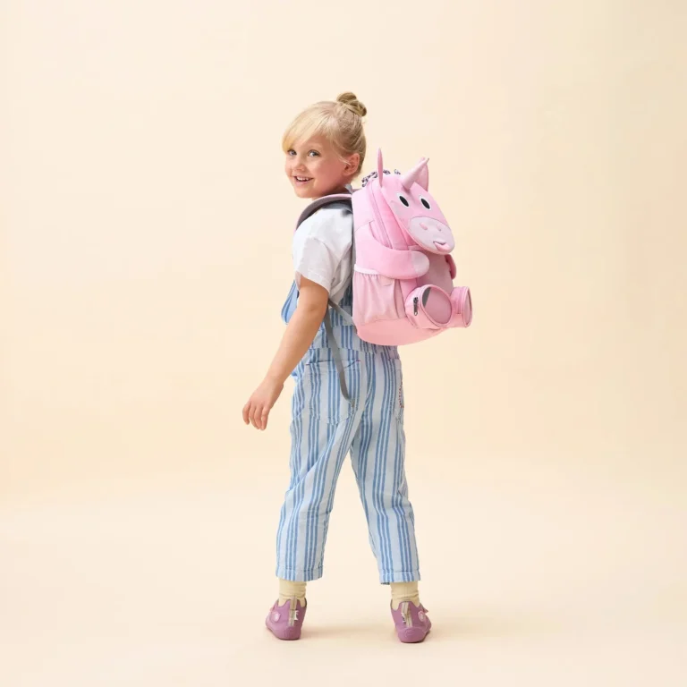 Child wearing the Affenzahn Großer Freund unicorn backpack — lifestyle shot