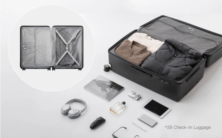 An open LEVEL8 Luminous Textured 28-inch check-in suitcase showing the packed interior and compression divider