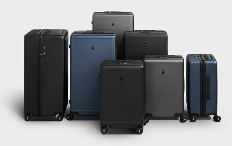 Studio lineup of LEVEL8 Luminous Textured suitcases across three sizes on a light grey background
