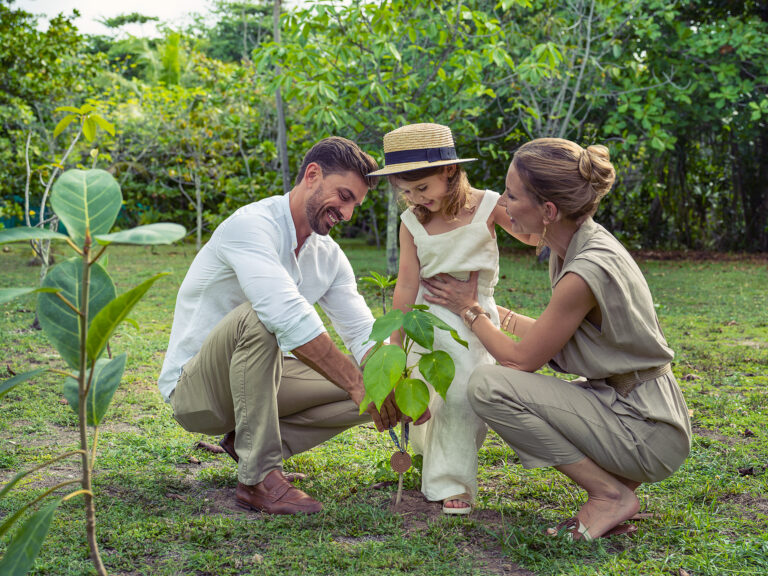 North Island, Seychelles — Experience the Island family planting tree