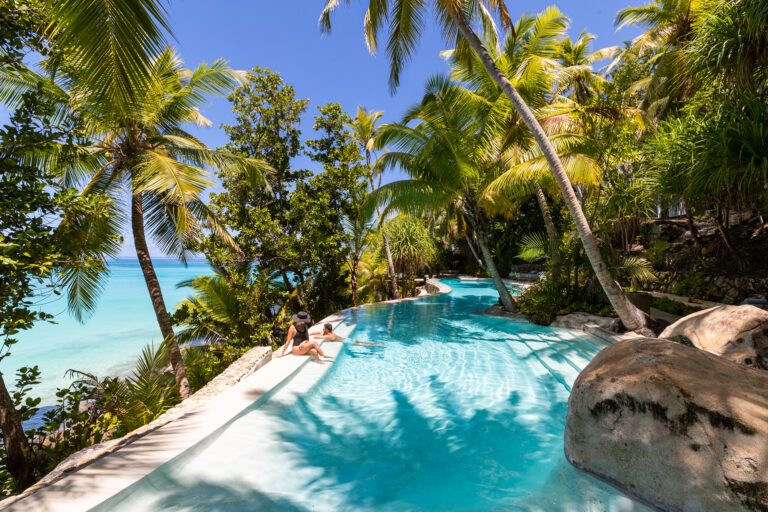 North Island, Seychelles — Main pool with guests