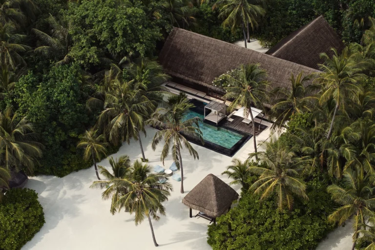 Grand Beach Villa exterior at One&Only Reethi Rah with white sand and ocean views