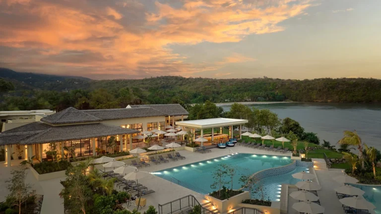Six Senses La Sagesse resort at golden hour with ocean backdrop