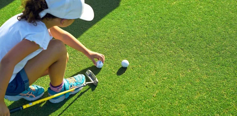 Children learning to play golf at Dalit Bay Golf and Country Club, Shangri-La Rasa Ria