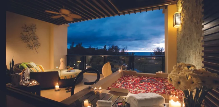 Rose petal bath preparation in a suite at Shangri-La Rasa Ria with candles and flower petals